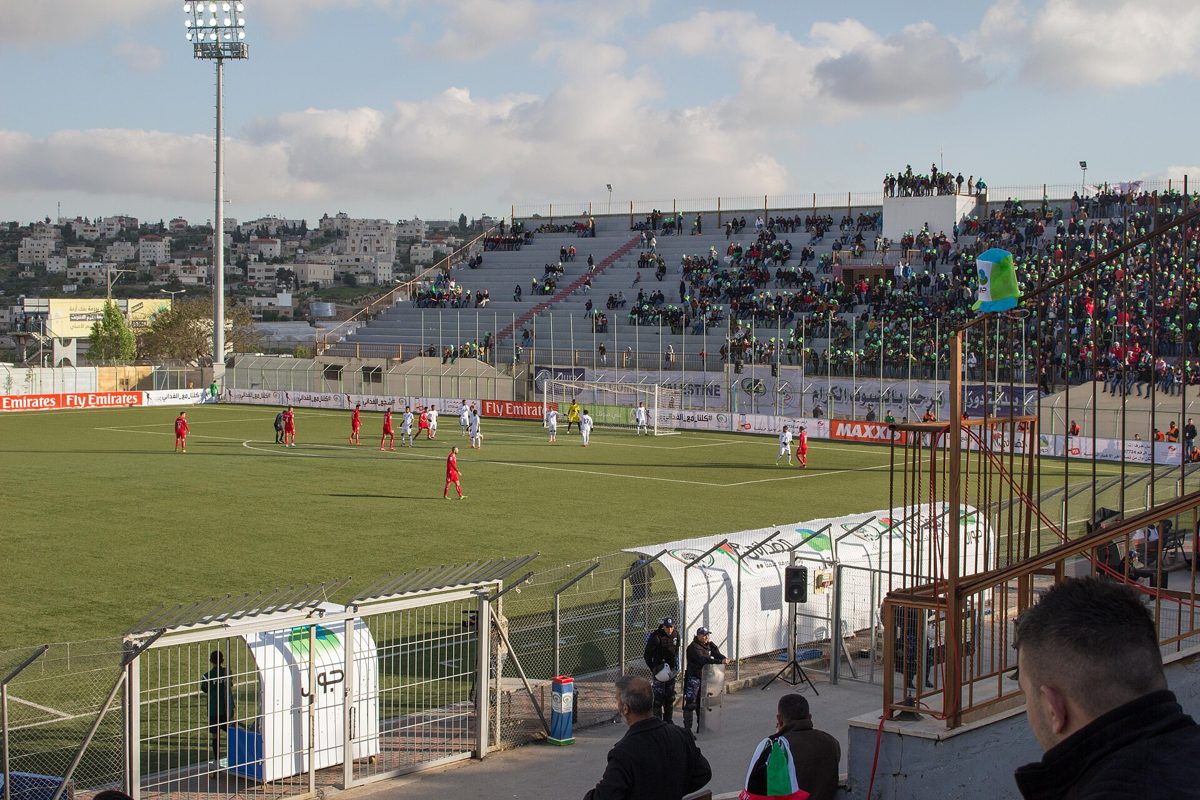 A football match at Dura Stadium, near Hebron.